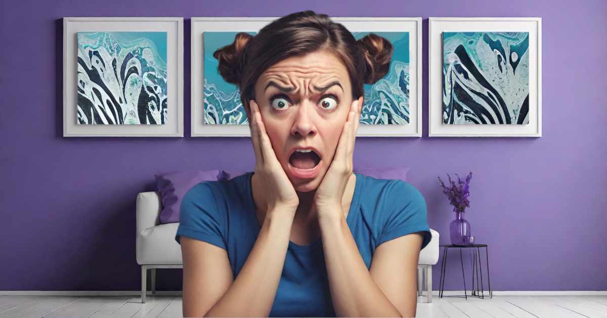 This image features a woman in a blue shirt, with her hands pressed against her cheeks, and her mouth wide open in an exaggerated expression of shock. She has brown hair styled into two buns on either side of her head, and her forehead is creased, emphasizing her expression. Behind her is a purple wall with four framed abstract paintings featuring swirling patterns in shades of blue, black and white. behind her, there is a white loveseat sofa with purple pillows and a small, modern black table with a purple vase holding lavender flowers to the right. The flooring is light-coloured, and the overall colour scheme of the room is coordinated with purples and blues.